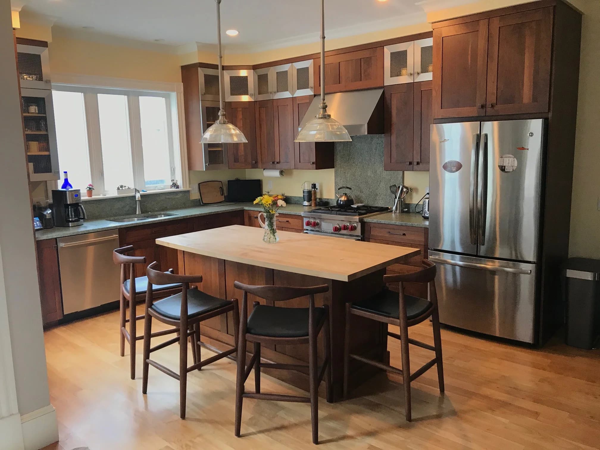 Portsmouth NH kitchen — walnut shaker cabinets, butcher block island, green granite counters
